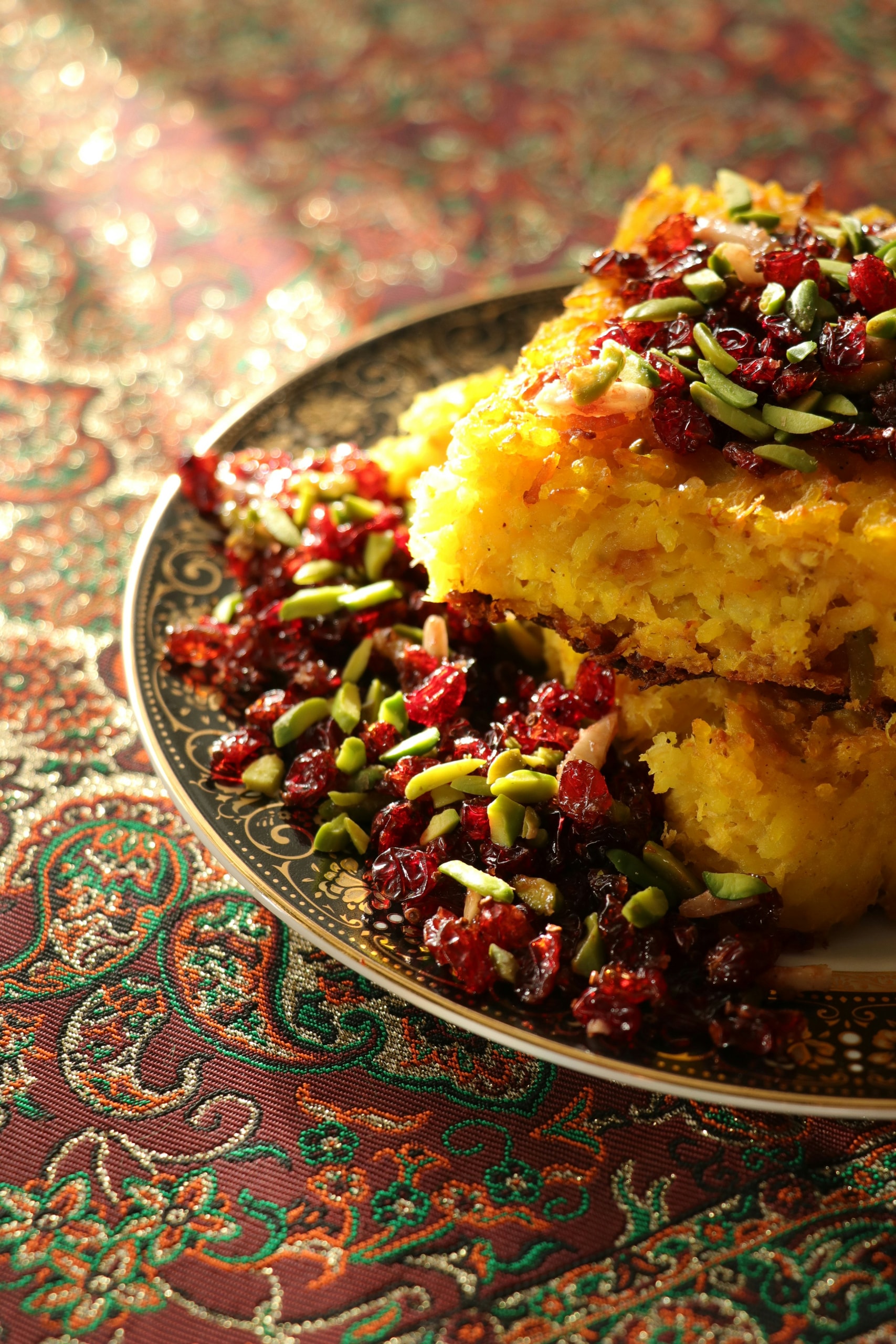 Saffron tahdig topped with barberries and pistachios